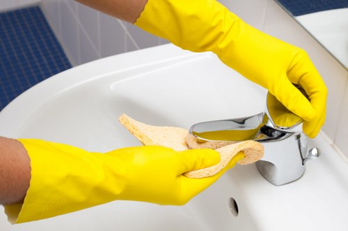 Cleaner wearing PPE while working on a carpeted floor